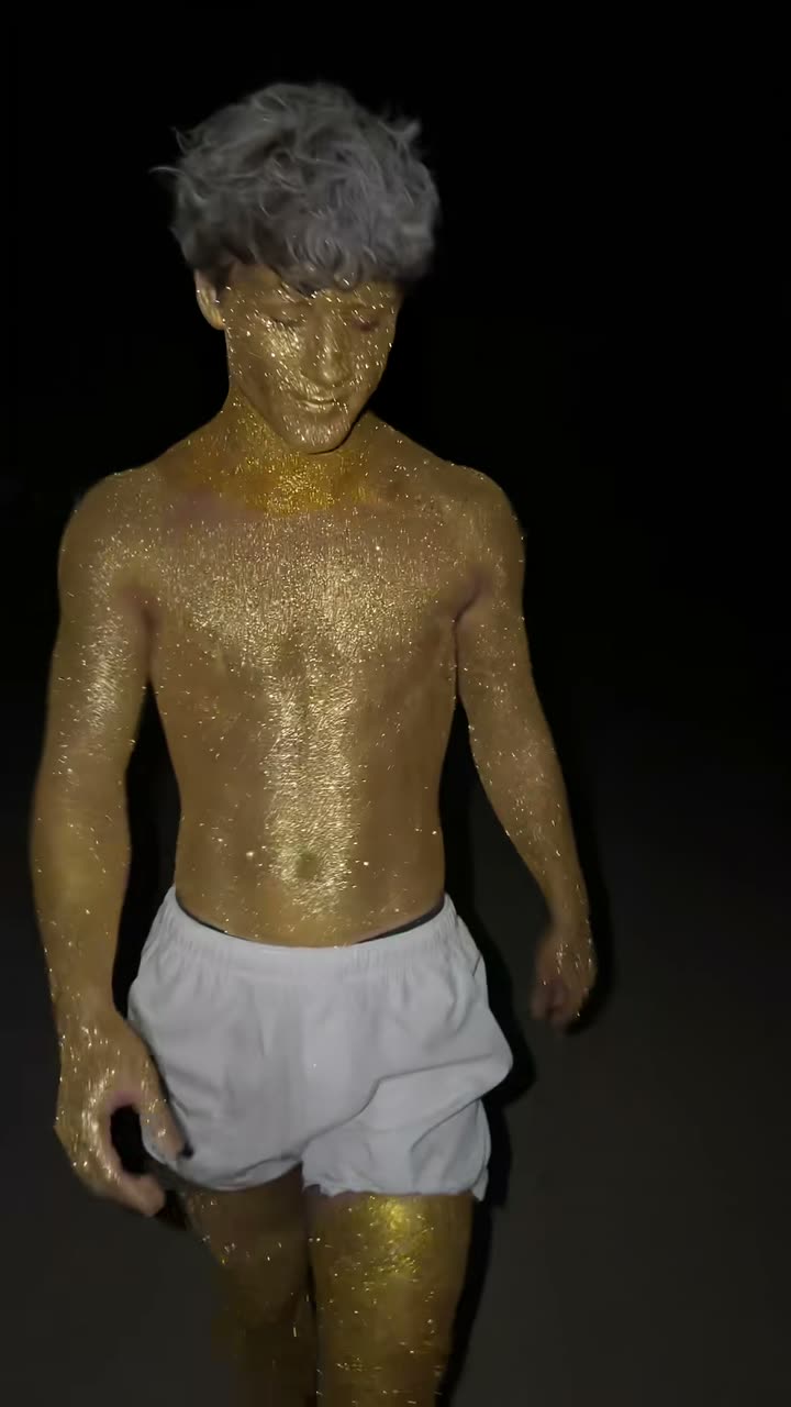 Head-to-toe gold body paint